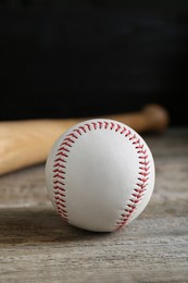 Photo of Baseball ball on wooden table. Sports equipment