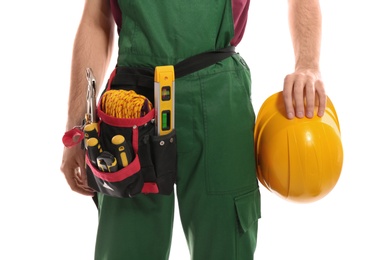 Professional construction worker with hard hat and tool belt on white background, closeup