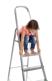 Photo of Little girl sitting on ladder on white background. Danger at home