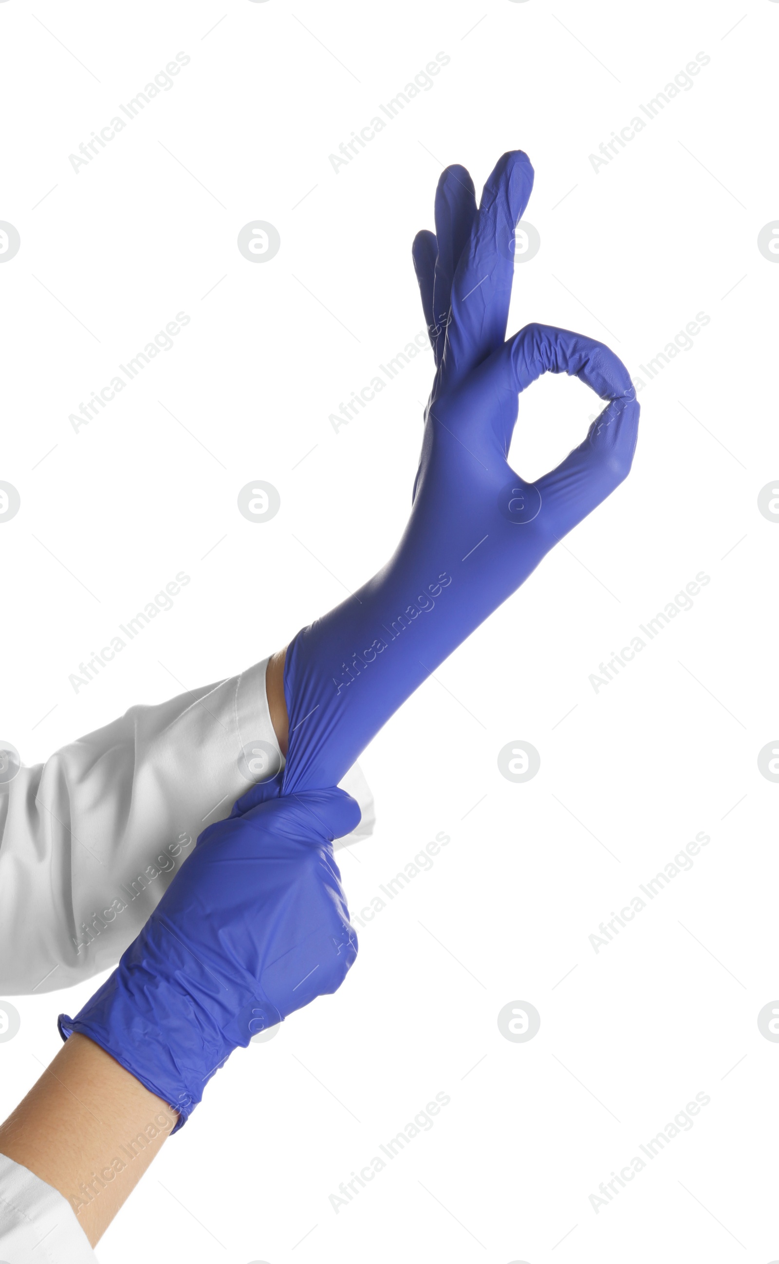 Photo of Doctor in medical gloves showing OK gesture on white background