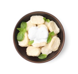 Bowl of tasty lazy dumplings with mint leaves and sour cream isolated on white, top view