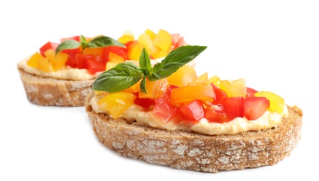 Tasty fresh tomato bruschettas on white background