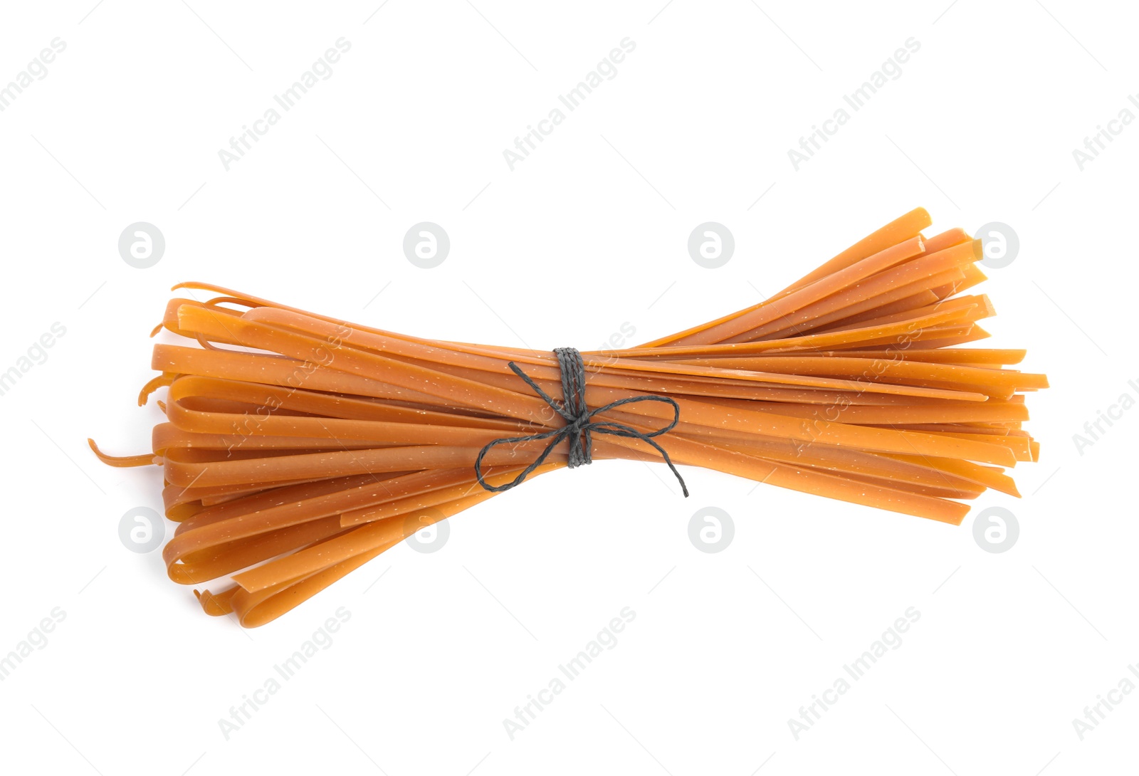 Photo of Uncooked buckwheat noodles isolated on white, top view