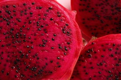 Photo of Delicious cut red pitahaya fruit, closeup view