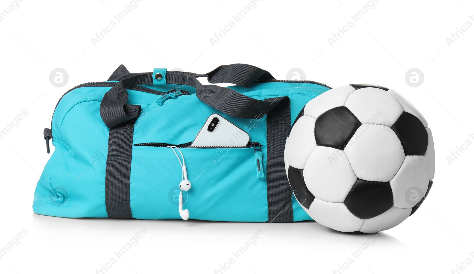 Photo of Sports bag and gym equipment on white background