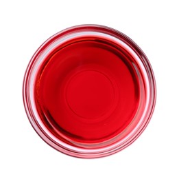 Photo of Glass bowl with red food coloring isolated on white, top view