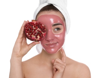 Photo of Woman with pomegranate face mask and fresh fruit on white background