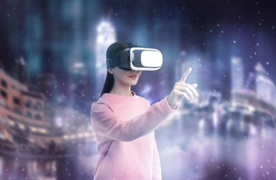 Woman using virtual reality headset and getting in simulated futuristic world 