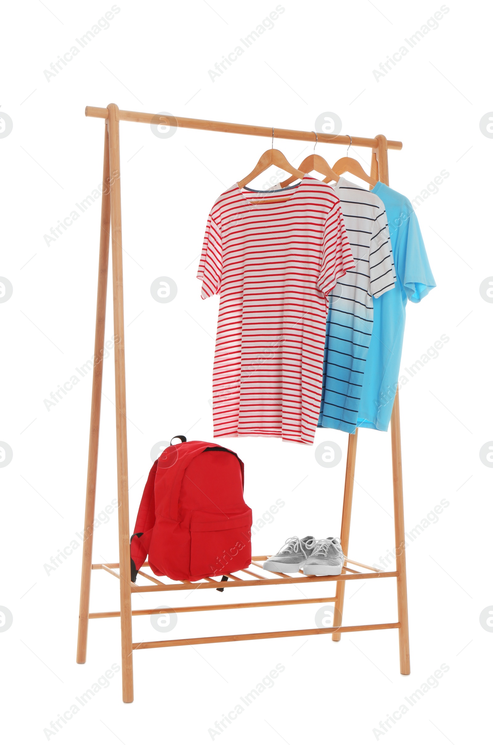 Photo of New wardrobe rack with stylish man's clothes and shoes on white background