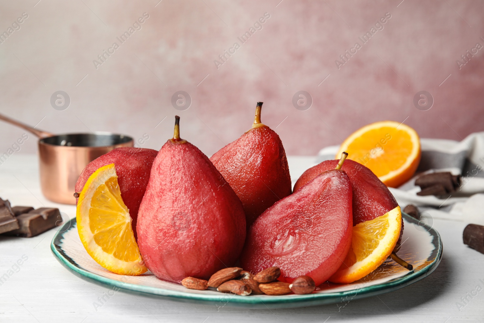 Image of Delicious mulled wine poached pears served on table