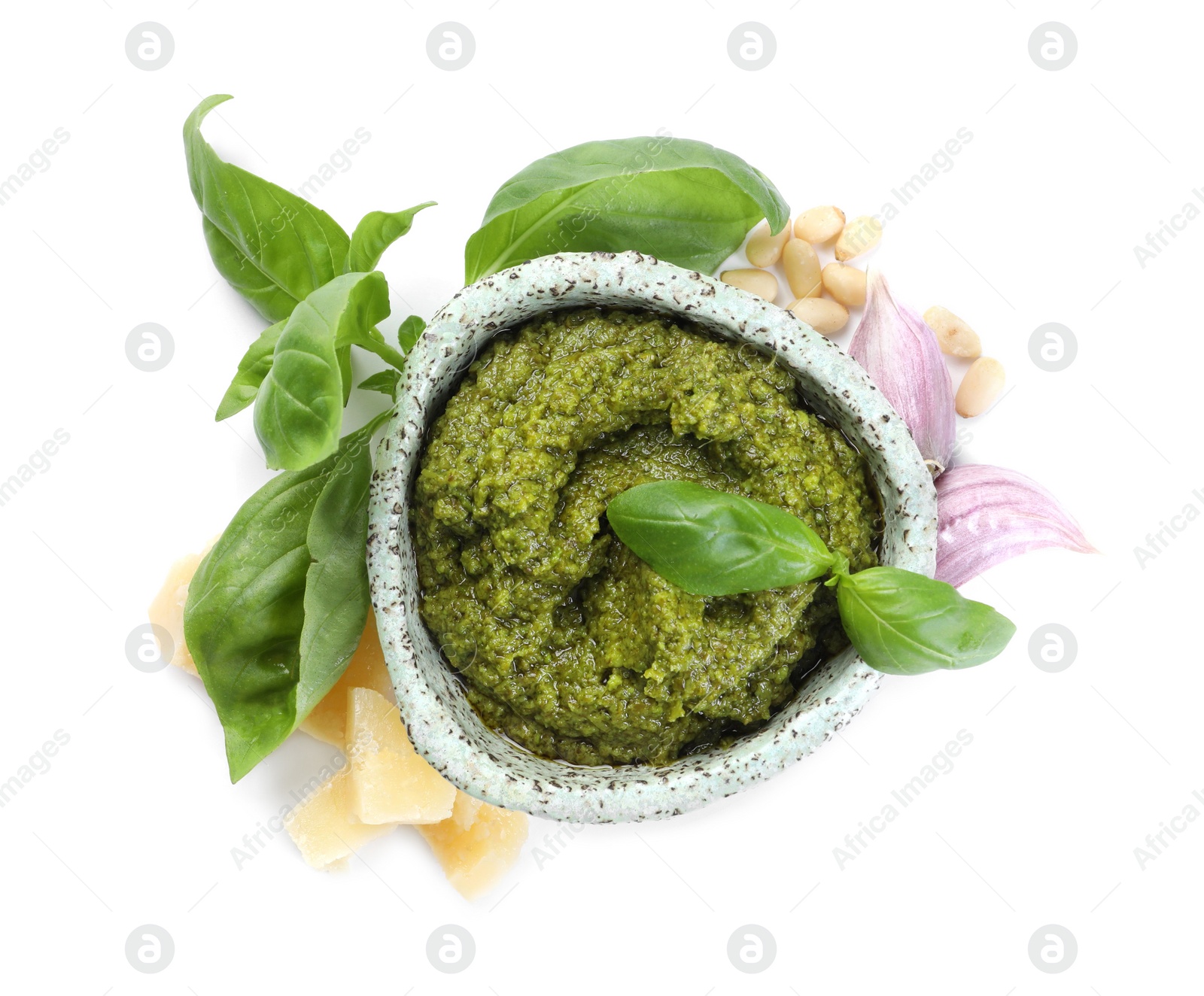 Photo of Fresh tasty pesto sauce and ingredients isolated on white, top view