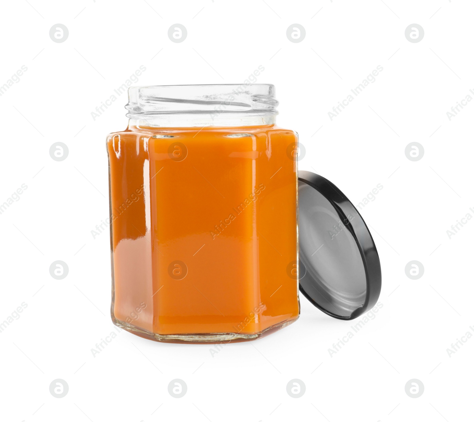 Photo of Delicious persimmon jam in jar isolated on white