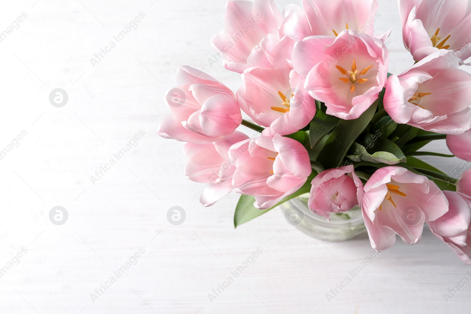 Photo of Beautiful tulips for Mother's Day on table, top view