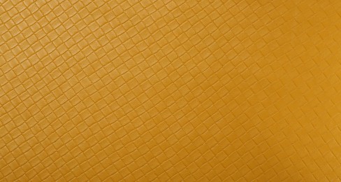 Beautiful yellow leather as background, top view