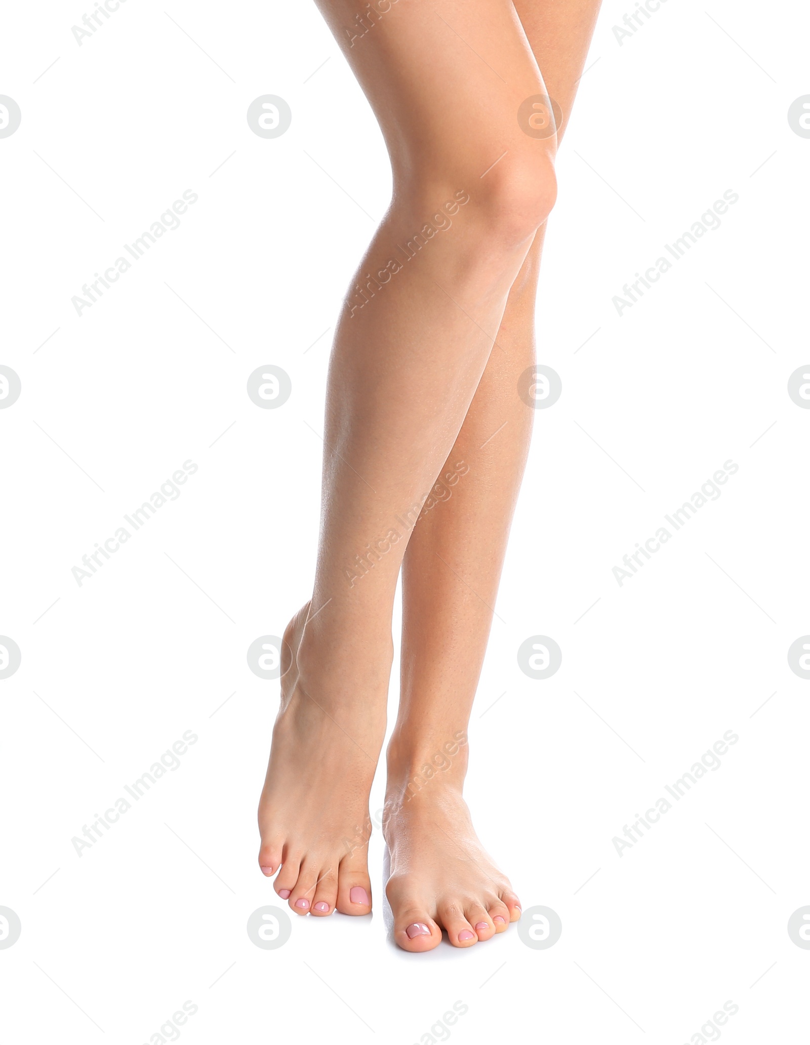 Photo of Woman with beautiful legs and feet on white background, closeup. Spa treatment