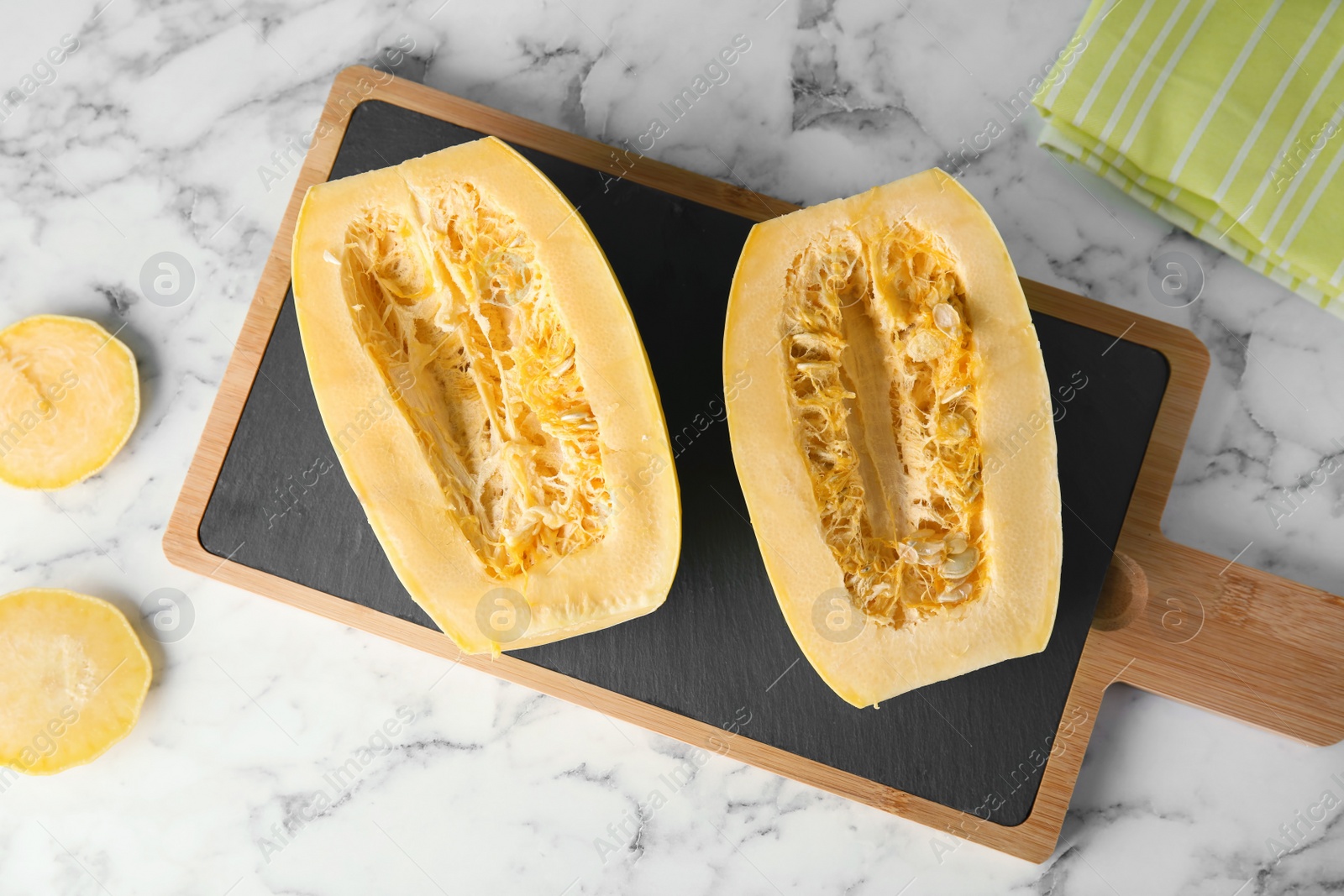 Photo of Flat lay composition with cut spaghetti squash on marble table