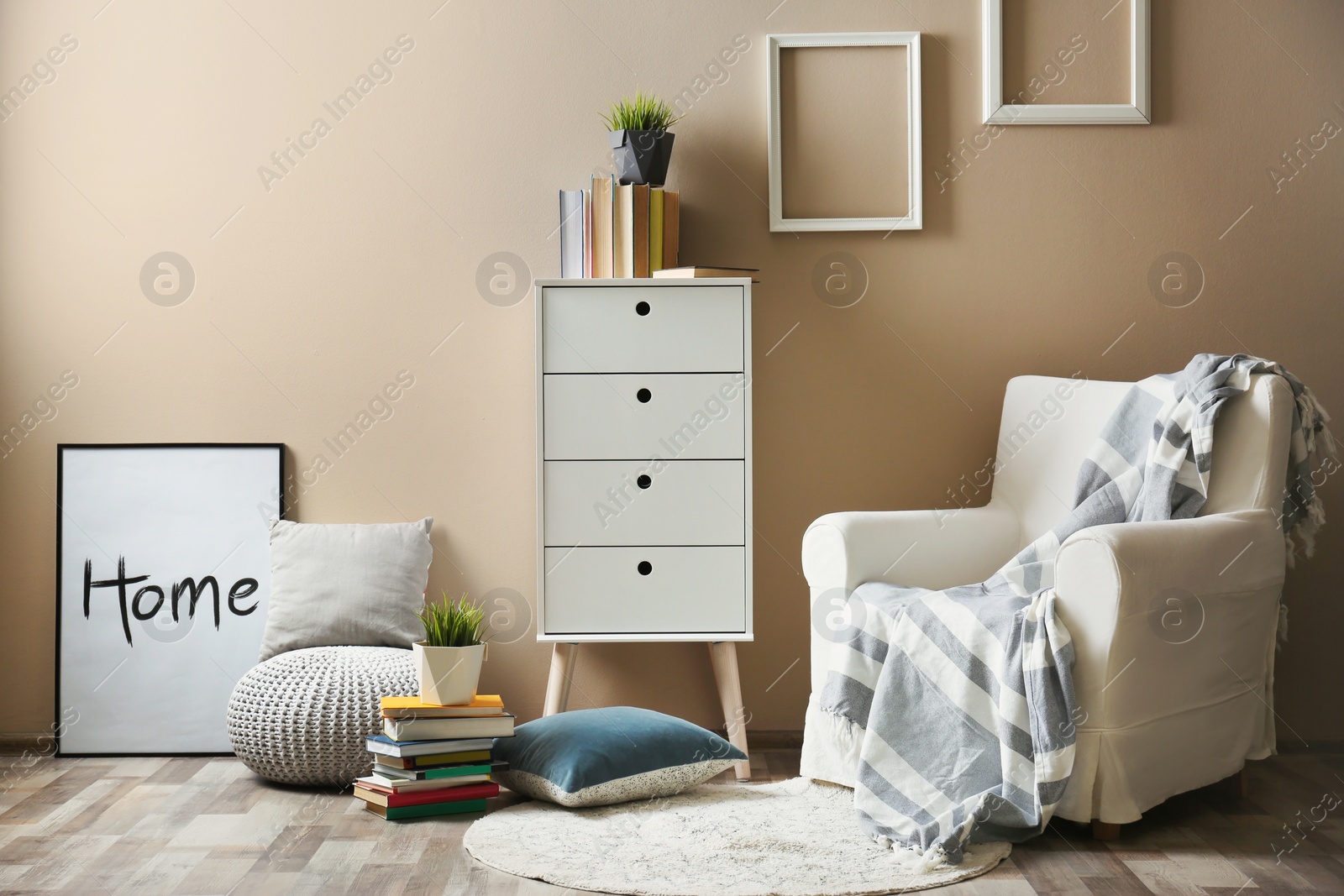 Photo of Cozy room interior with books and armchair