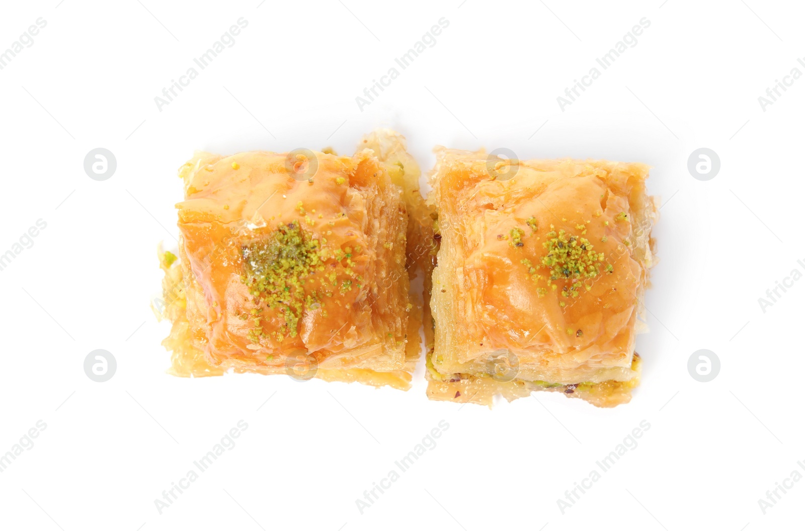 Photo of Delicious baklava with pistachios isolated on white, top view