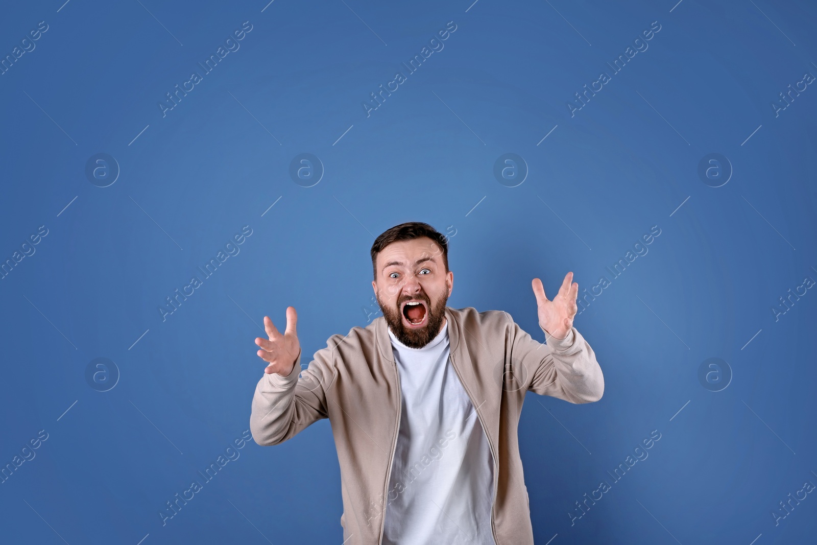 Photo of Portrait of handsome bearded man on color background