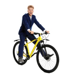 Young businessman riding bicycle on white background