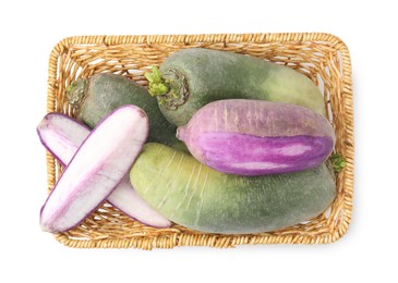 Photo of Purple and green daikon radishes in wicker basket isolated on white, top view