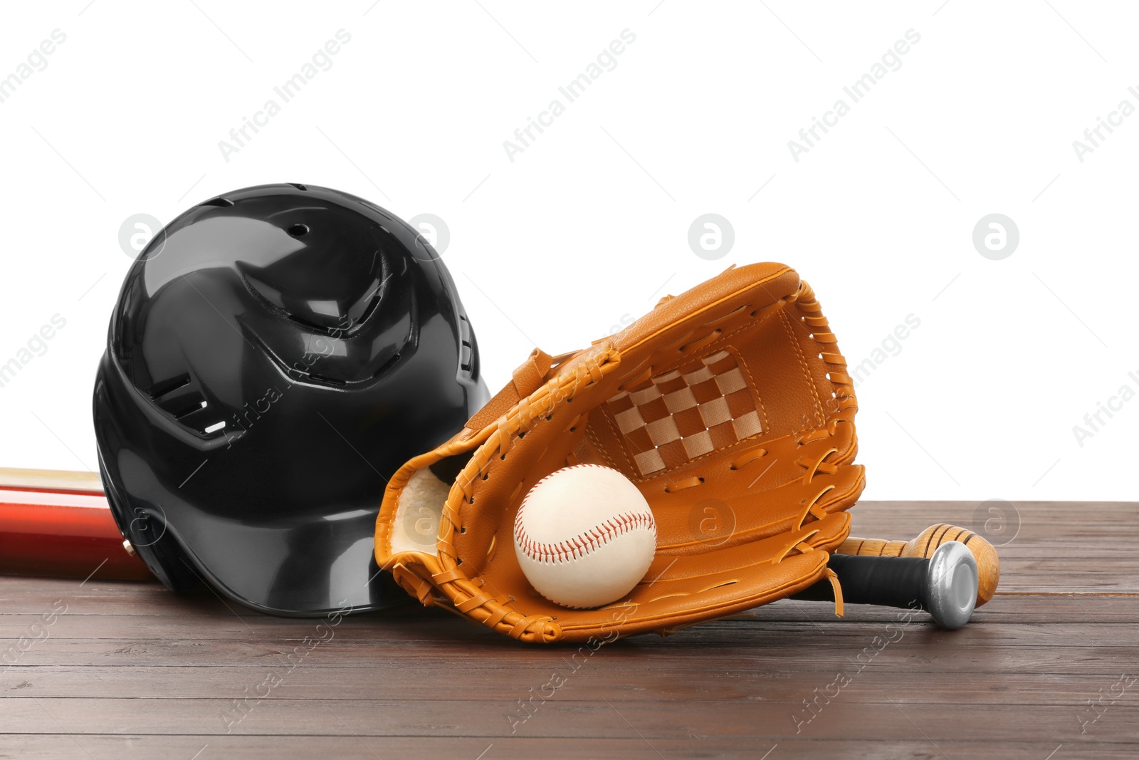 Photo of Baseball glove, bats, ball and batting helmet on wooden table against white background