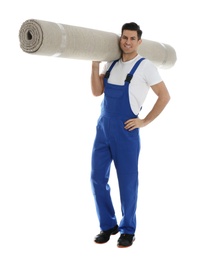 Photo of Male worker with rolled carpet on white background