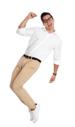 Photo of Handsome young man with glasses dancing on white background