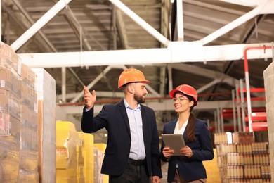 Image of Manager and supervisor at warehouse. Logistics center
