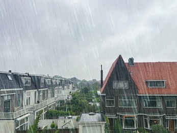 Image of Picturesque view of city street with beautiful buildings on rainy day