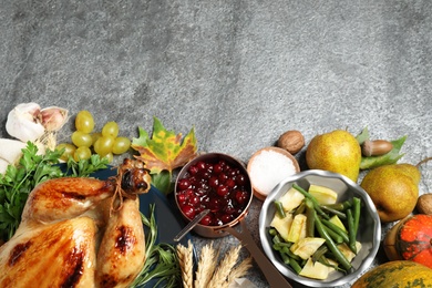 Photo of Flat lay composition with delicious turkey on grey background, space for text. Happy Thanksgiving day