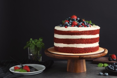 Photo of Composition with delicious homemade red velvet cake and space for text on black background