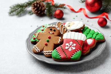 Photo of Tasty homemade Christmas cookies on light grey table. Space for text