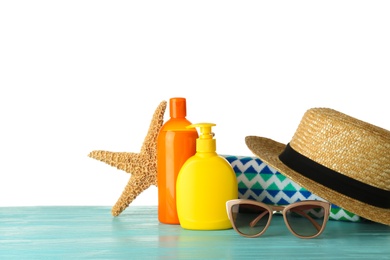 Photo of Set of beach accessories on table against white background. Space for text