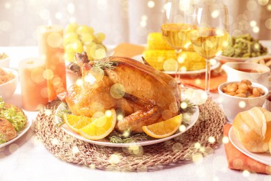 Image of Delicious roasted turkey served for Christmas dinner on table