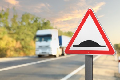 Image of Sign Speed Bump near asphalt road outdoors 