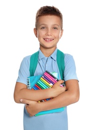 Photo of Cute little boy in school uniform with backpack and stationery on white background