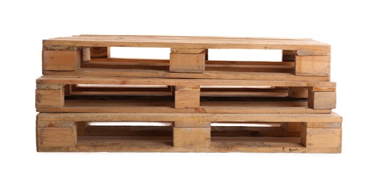 Photo of Stacked wooden pallets isolated on white. Transportation and storage