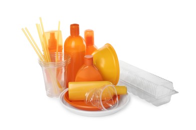 Photo of Pile of different plastic items on white background