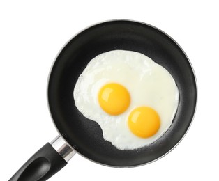 Photo of Frying pan with tasty cooked eggs isolated on white, top view