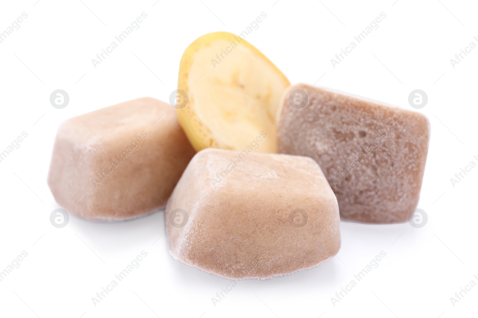 Photo of Frozen banana puree cubes and fruit on white background