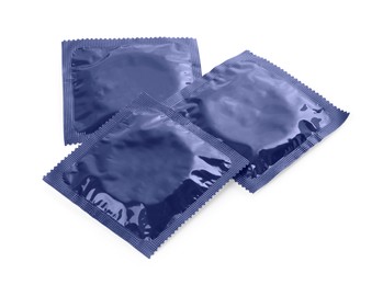 Photo of Packaged condoms on white background. Safe sex