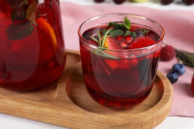 Delicious refreshing sangria on table, closeup view