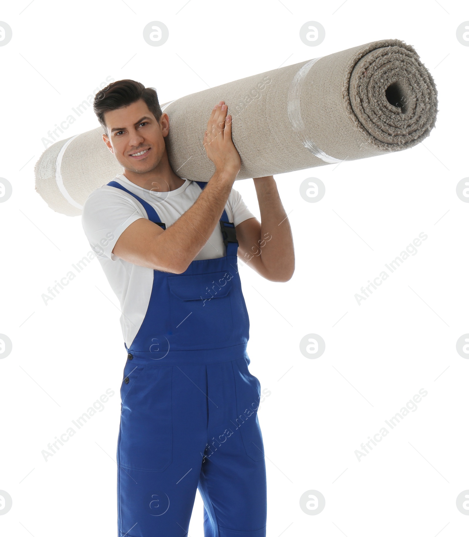 Photo of Male worker with rolled carpet on white background