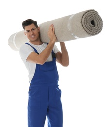 Photo of Male worker with rolled carpet on white background