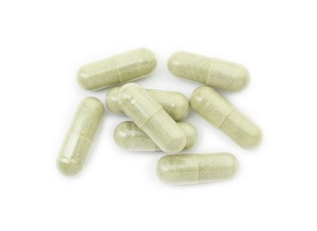 Vitamin capsules isolated on white, top view. Health supplement