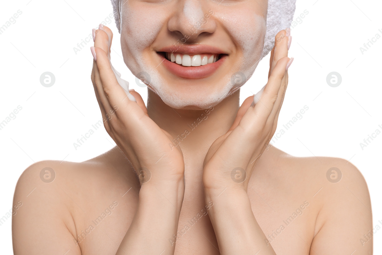 Photo of Young woman washing face with cleansing foam on white background, closeup. Skin care cosmetic