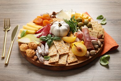 Photo of Different tasty appetizers served on wooden table
