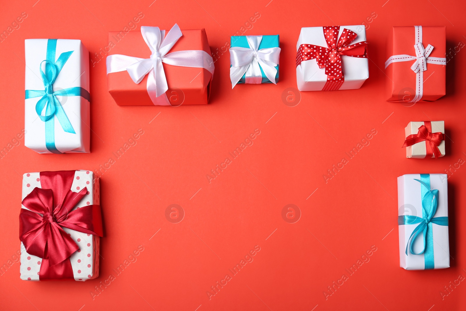 Photo of Flat lay composition with gift boxes on color background