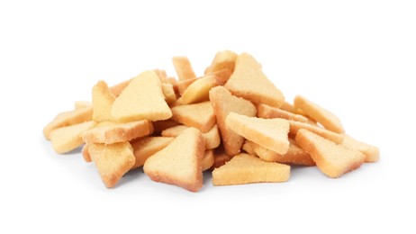 Pile of delicious crispy rusks on white background
